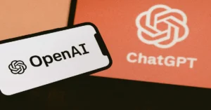 User interacting with ChatGPT GPT-5.1 on laptop in modern workspace.